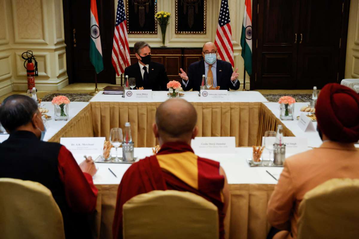 U.S. Secretary of State Antony Blinken and U.S. Ambassador to India Atul Keshap (back right), deliver remarks to civil society organization representatives in a meeting room at the Leela Palace Hotel in New Delhi, India, on July 28, 2021.