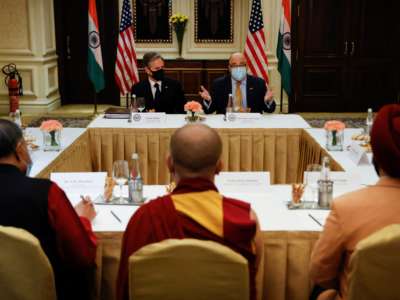 U.S. Secretary of State Antony Blinken and U.S. Ambassador to India Atul Keshap (back right), deliver remarks to civil society organization representatives in a meeting room at the Leela Palace Hotel in New Delhi, India, on July 28, 2021.
