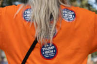 A woman wears "Trump Won" stickers as people gather to show support at a watch party regarding the results of the Arizona State Senate report of an audit of the 2020 election at the Arizona State Capitol in Phoenix, Arizona, on September 24, 2021. Trump lost.
