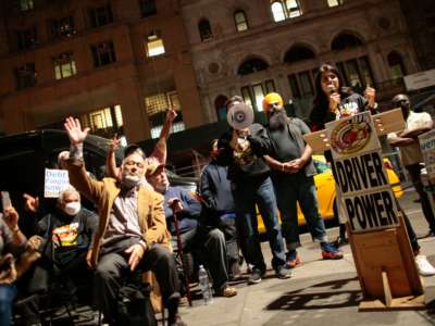 Yellow cab drivers attend a rally demanding debt forgiveness for cabbies, along with some drivers taking part in a hunger strike, outside City Hall in New York City, on October 20, 2021.
