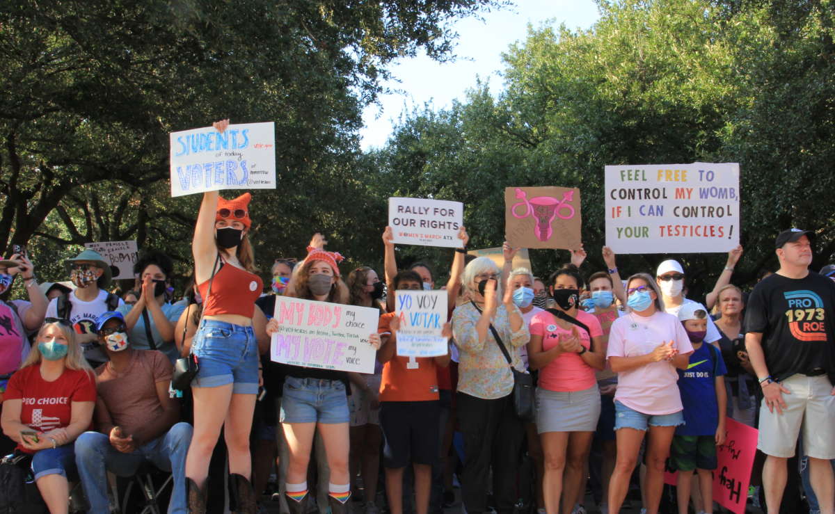Protesters rally for abortion justice on the south lawn of the Texas State Capitol in Austin on October 2 during Women's March ATX.