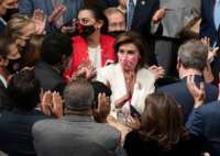 Members applaud Speaker of the House Nancy Pelosi (C) (D-California) and chant her name after she announced the passage of the Build Back Better Act on the floor of the House on Capitol Hill in Washington, D.C., on November 19, 2021.