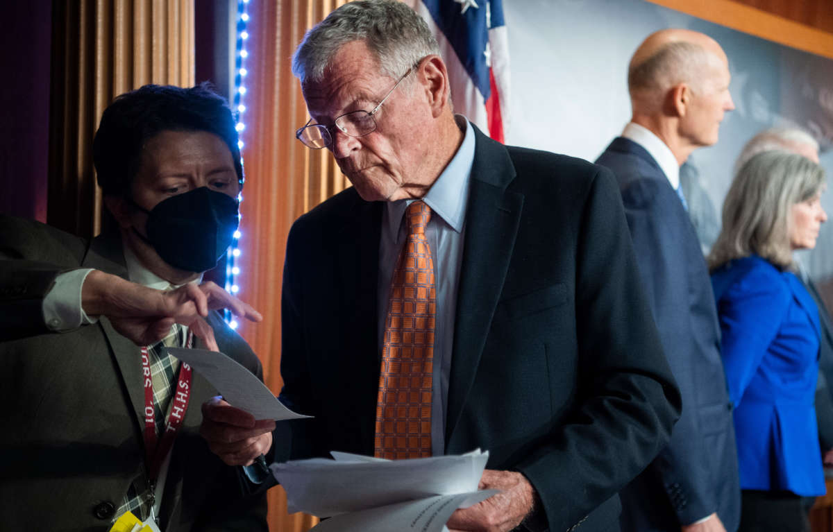 Ranking member Sen. Jim Inhofe speaks with an aide during a news conference with Republican members of the Senate Armed Services Committee on Afghanistan in the U.S. Capitol on September 14, 2021.