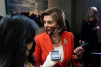Speaker of the House Nancy Pelosi talks with reporters after leaving a House Democratic Caucus meeting at the Capitol on November 2, 2021, in Washington, D.C.