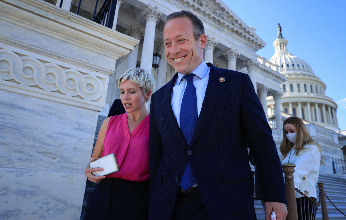 Problem Solvers Caucus Co-Chair Rep. Josh Gottheimer is pursued by a group of reporters as he leaves the U.S. Capitol on September 30, 2021, in Washington, D.C.