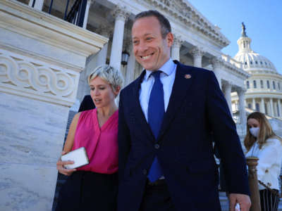 Problem Solvers Caucus Co-Chair Rep. Josh Gottheimer is pursued by a group of reporters as he leaves the U.S. Capitol on September 30, 2021, in Washington, D.C.