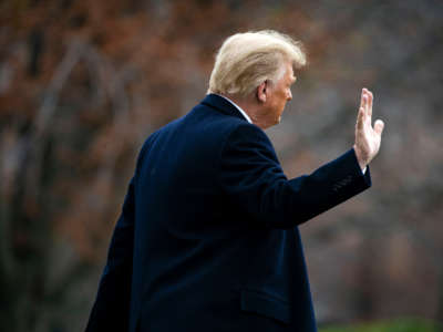 President Donald Trump waves as he departs on the South Lawn of the White House, on December 12, 2020, in Washington, D.C.