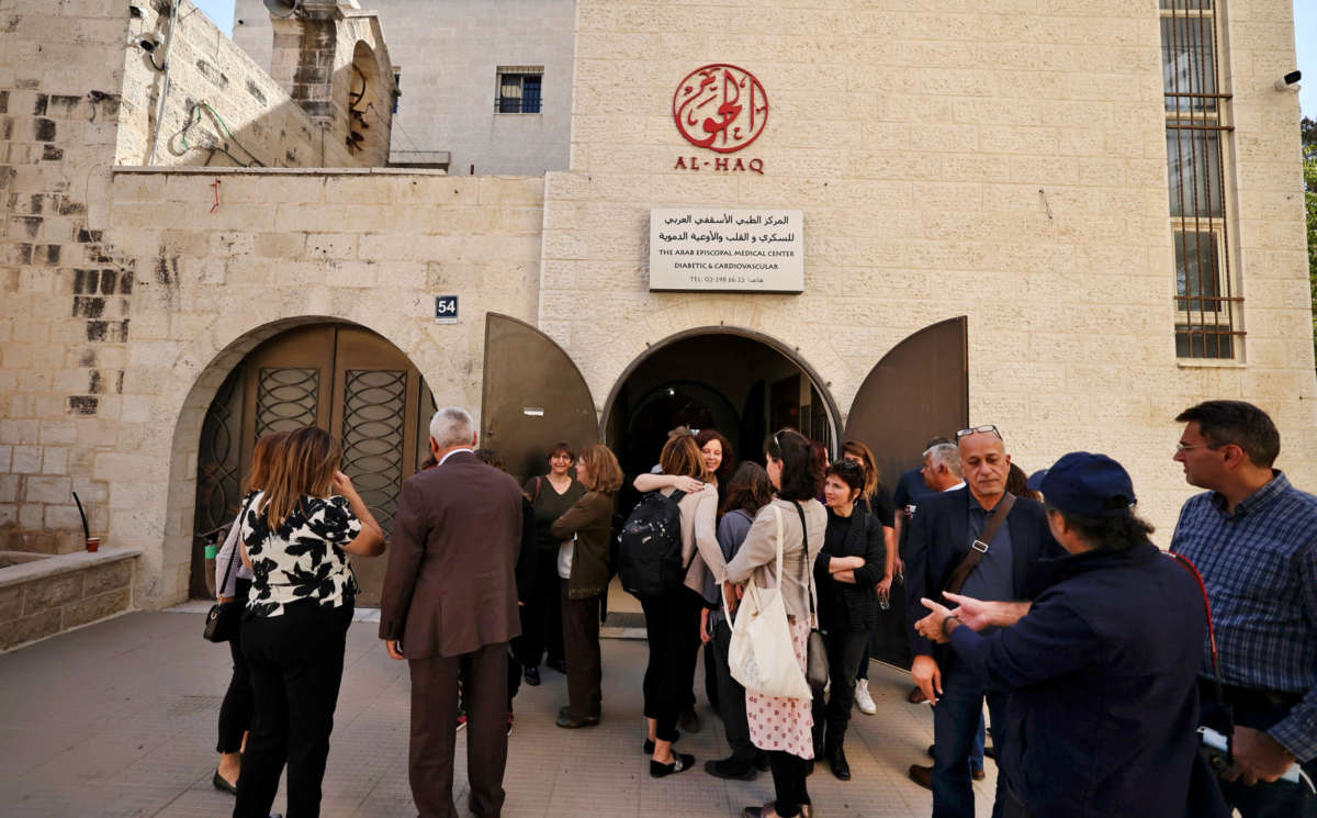 Israeli left-wing activists gather with Palestinian activists at the Al-Haq Foundation in the West Bank city of Ramallah to denounce Israel's decision to declare six Palestinian human rights groups as "terror organizations," on October 27, 2021.