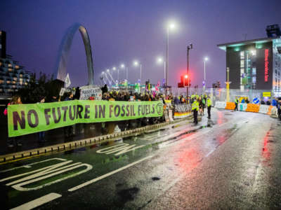 People protest for better climate protection on the sidelines of the UN Climate Change Conference COP26 in Glasgow on November 8, 2021.