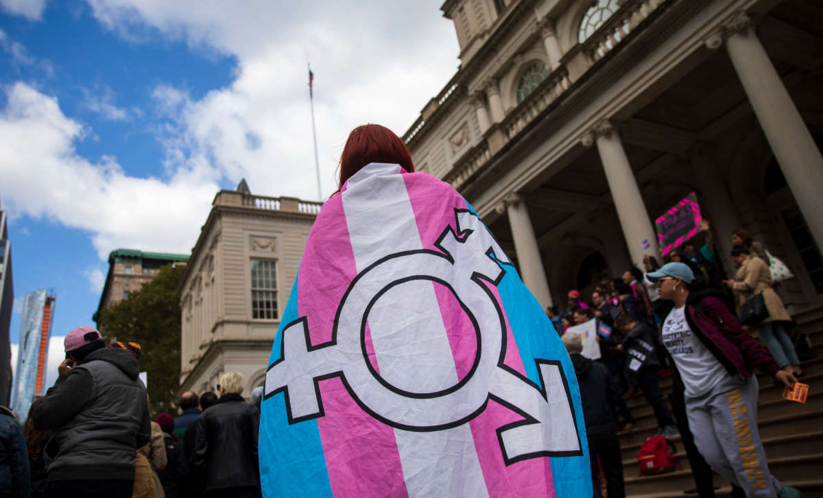 People rally in support of transgender rights on the steps of New York City Hall, October 24, 2018, in New York City.