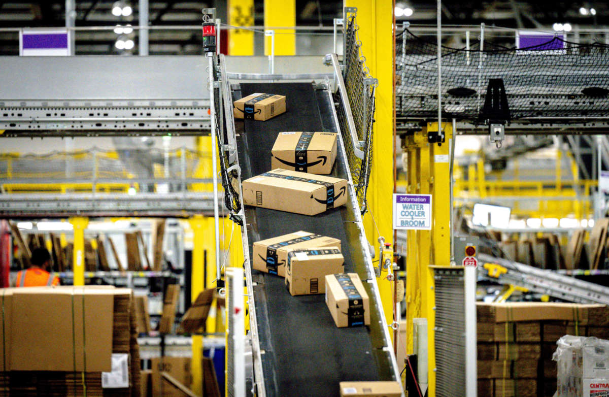 Packages move along a conveyor at Amazon fulfillment center in Eastvale, California, on August 31, 2021.