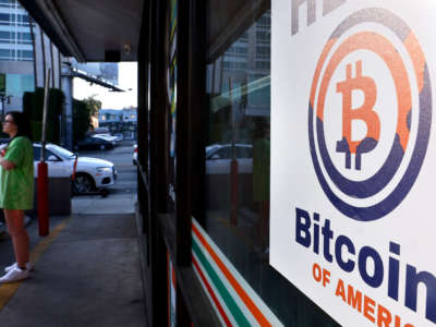 A sign advertising a Bitcoin ATM is posted at a 7-Eleven store on November 10, 2021, in Los Angeles, California.