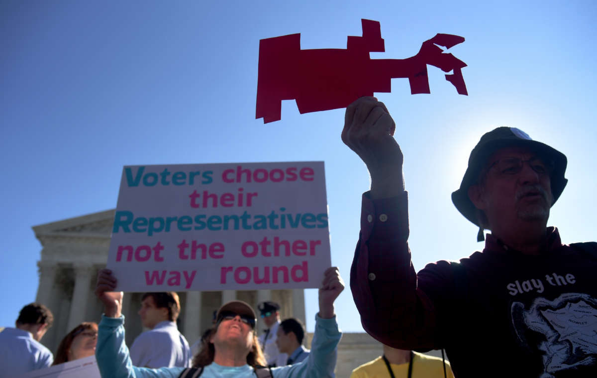Demonstrators gather outside of the Supreme Court to call for an end to partisan gerrymandering on October 3, 2017, in Washington, D.C.