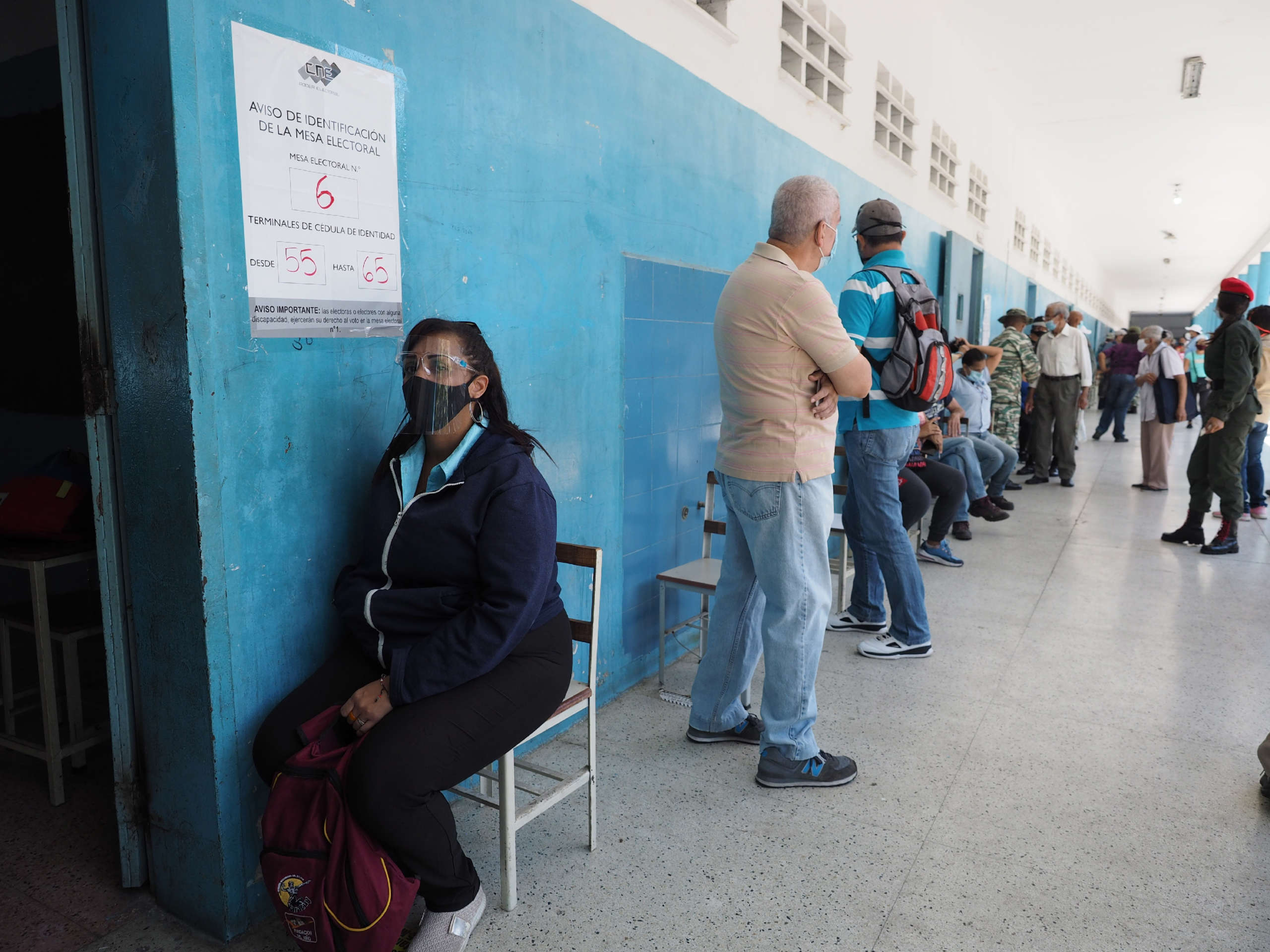 Voters await to be called to enter the voting booth in order to maintain social distancing at the Liceo Pedro Emilio Coll in the Coche Parish in Caracas Venezuela during elections on November 21, 2021.