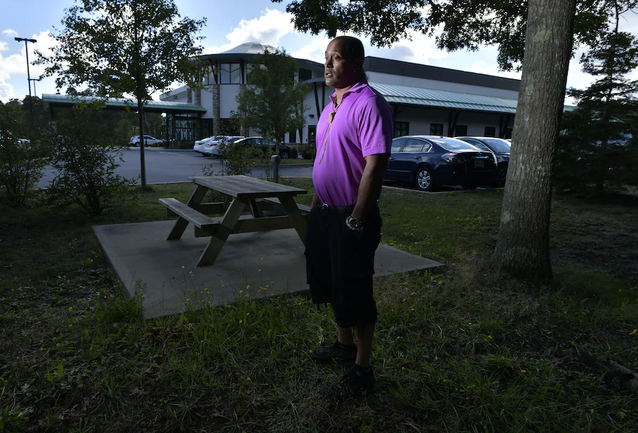 David Weeden, a Mashpee Wampanoag who is a tribal council member and their historic preservation officer, stands near the tribal government center.