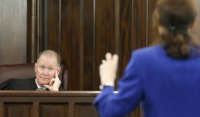Prosecutor Linda Dunikoski stands in front of Judge Timothy Walmsley during the trial of the three men involved in the shooting of Ahmaud Arbery at Glynn County Superior Court on November 19, 2021, in Brunswick, Georgia.