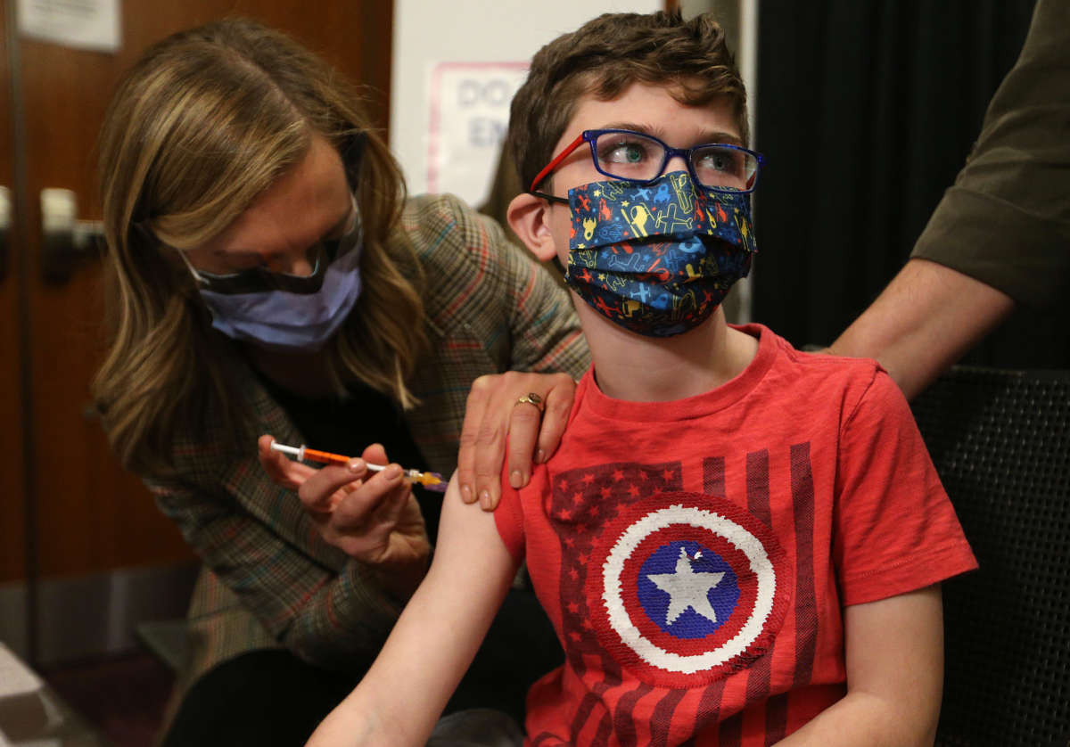 Children between the ages of 5 and 11 years old, who are part of the Hospital for Sick Children, are some of the first of that age group to get vaccinated for COVID-19 at the Metro Toronto Convention Centre in Toronto, Canada, on November 23, 2021.