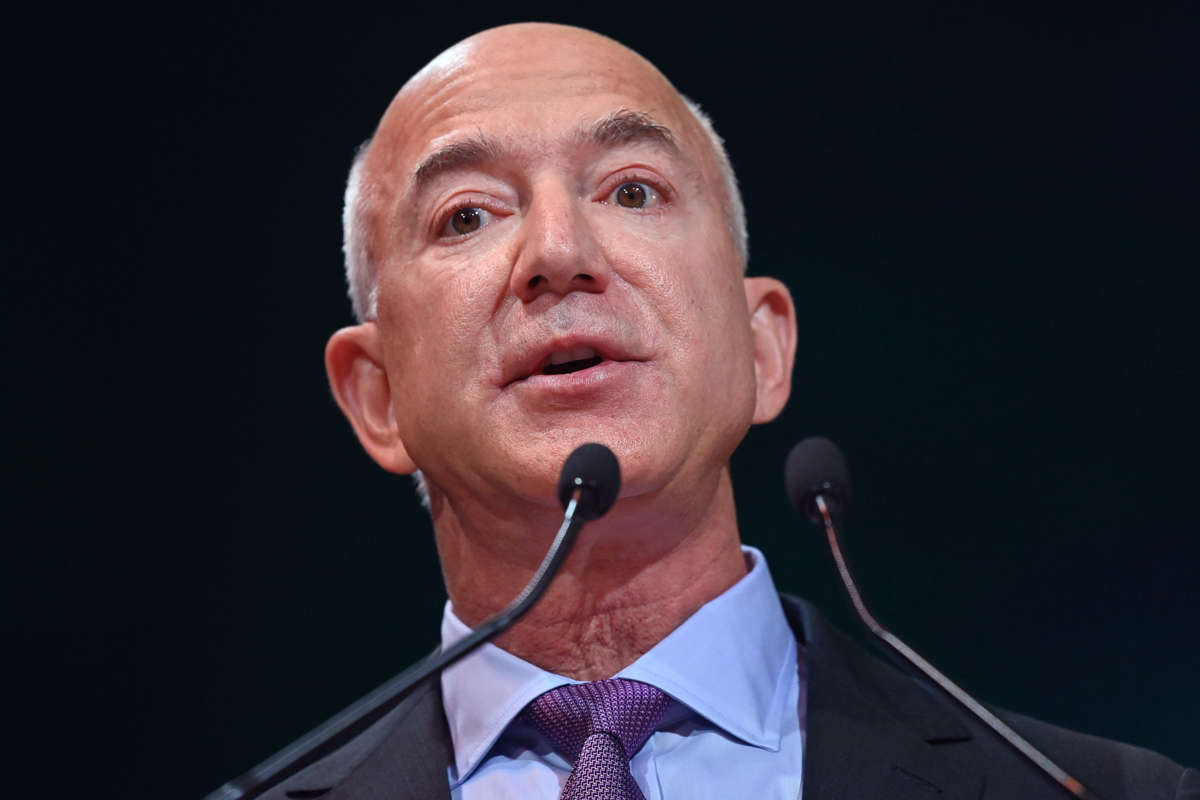 Jeff Bezos speaks into a microphone