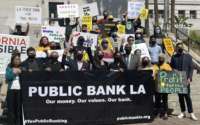 Advocates for a public bank rally in Los Angeles on October 5, 2021.