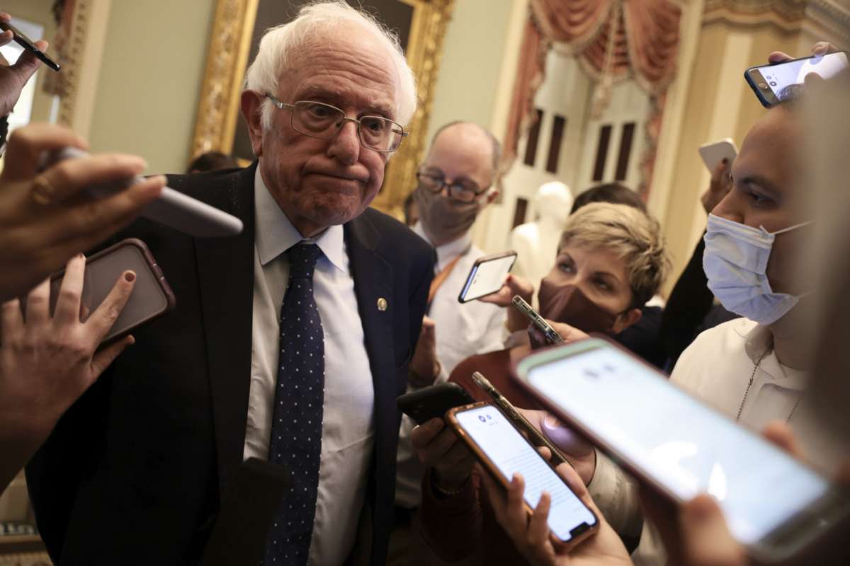 Sen. Bernie Sanders speaks with reporters after leaving a Senate Democrat luncheon on October 19, 2021, in Washington, D.C.
