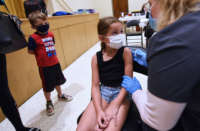 A girl recieves the covid vaccine