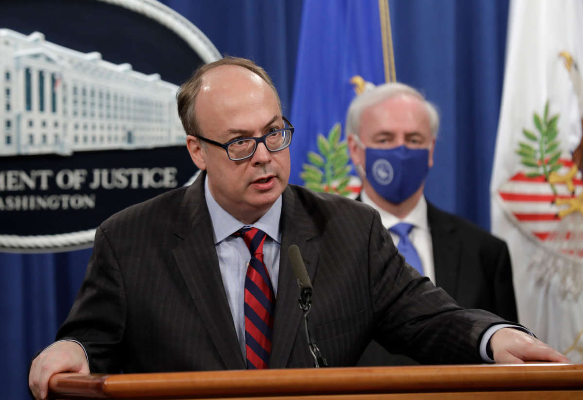 Acting Assistant Attorney General Jeffrey Clark speaks next to Deputy Attorney General Jeffrey Rosen at a news conference at the Justice Department in Washington, D.C., on October 21, 2020.