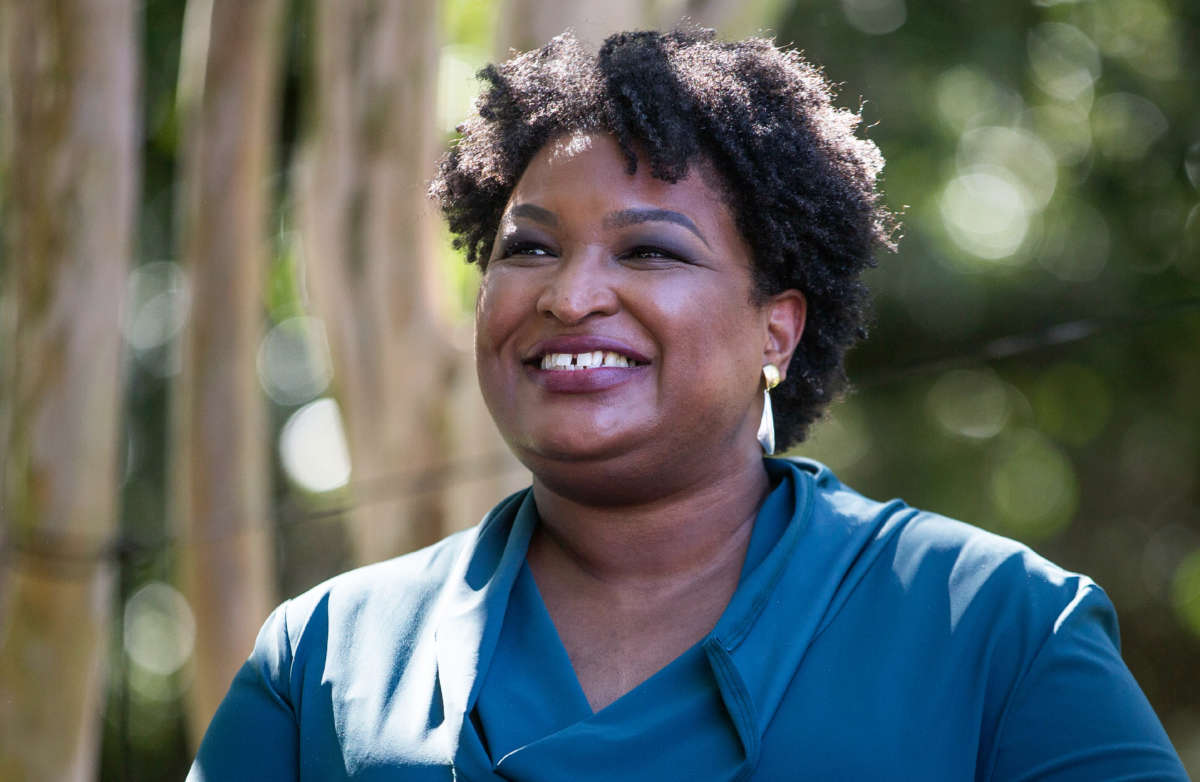 Former Representative and voting rights activist Stacey Abrams is introduced before speaking at a Souls to the Polls rally on October 17, 2021, in Norfolk, Virginia.