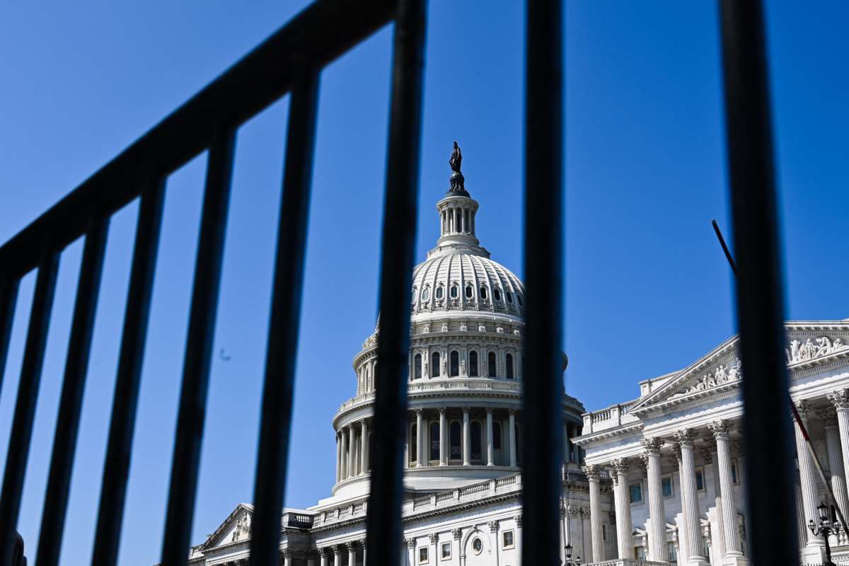The United States Capitol, as seen through bars