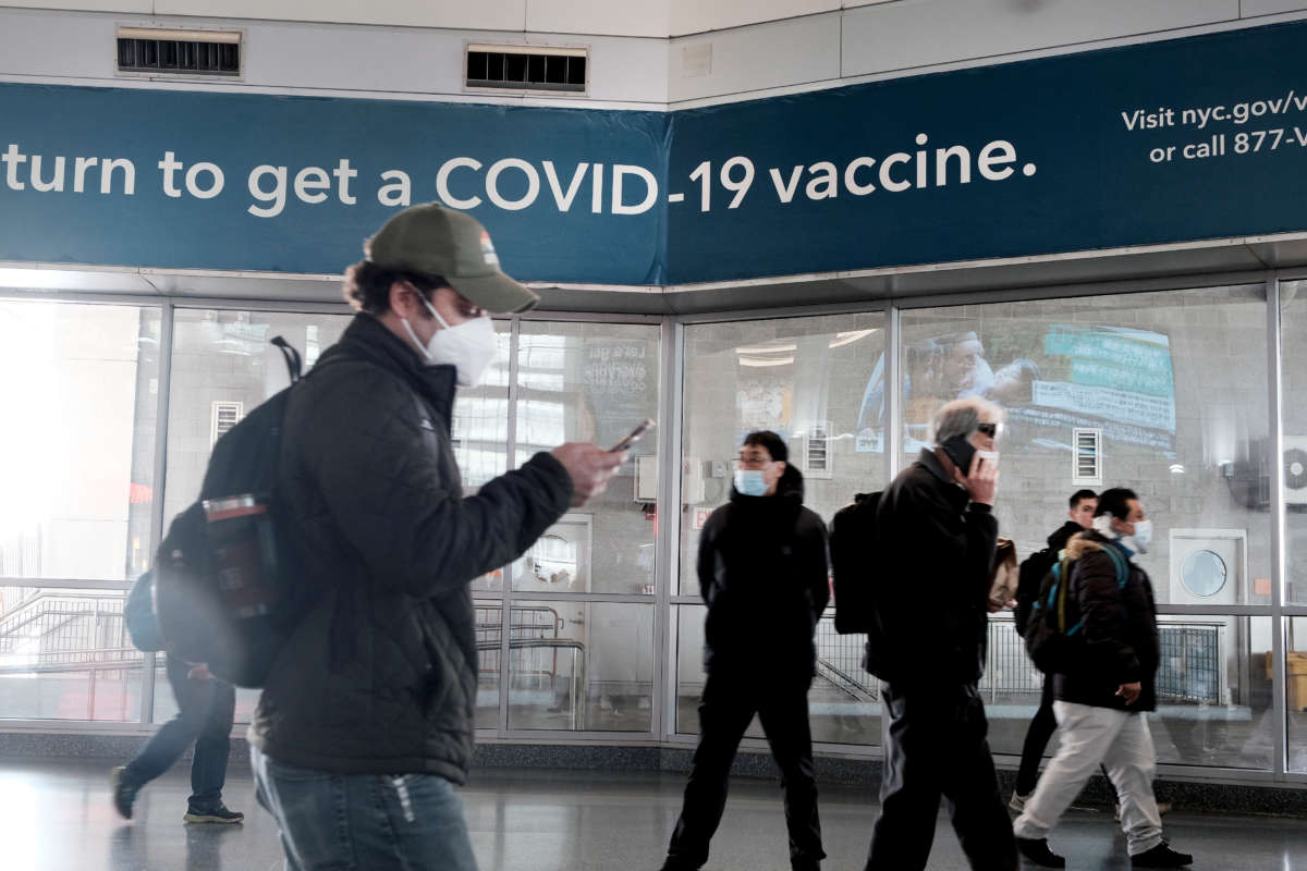 A sign urges people to get the COVID vaccine at the Staten Island Ferry terminal on November 29, 2021, in New York City.