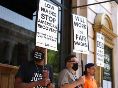 Activists with One Fair Wage participate in a “wage strike" demonstration outside of the Old Ebbitt Grill restaurant on May 26, 2021, in Washington, D.C.
