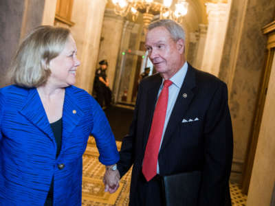 Former Senators John Breaux and Mary Landrieu are seen in the Capitol on June 11, 2019.