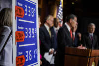 A poster showing gas price increases is seen as Sen. John Barrasso speaks alongside other Republican Senators during a press conference on rising gas an energy prices at the U.S. Capitol on October 27, 2021, in Washington, D.C.