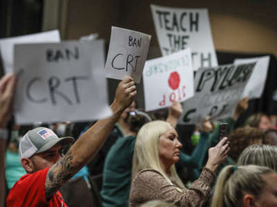 Proponents and opponents to teaching Critical Race Theory demonstrate as the Placentia Yorba Linda School Board in Yorba Linda, California, discusses a proposed resolution to ban it from being taught in schools, on November 16, 2021.