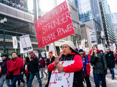 Striking Chicago public school teachers and other unionized staff and their supporters march through the Loop on day two of their strike on October 18, 2019, in Chicago, Illinois.