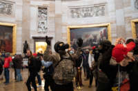 Trump supporters roam under the U.S. Capitol rotunda after breaching the Capitol Building on January 6, 2021, in Washington, D.C.