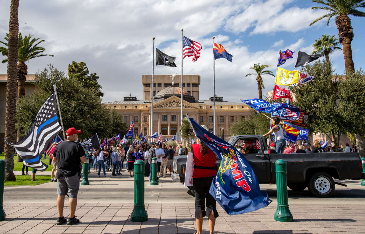 Trump supporters attend a Stop The Steal rally just hours after Joe Biden was named President-elect on November 7, 2020, at the State Capitol in Phoenix, Arizona.