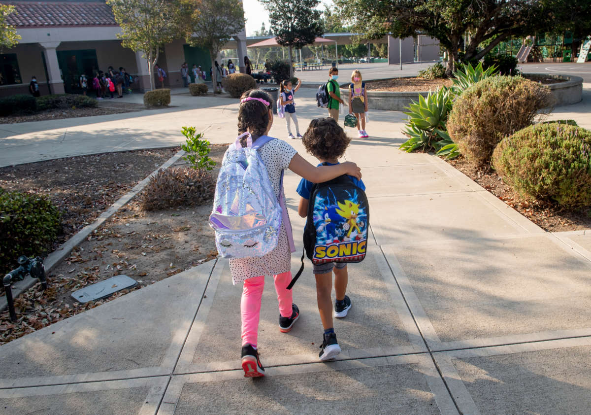 Students make their way to class for the first day of school at Tustin Ranch Elementary School in Tustin, California, on August 11, 2021.