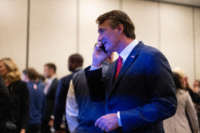Glenn Youngkin speaks on the phone as he watches results come in on election night at the Westfields Marriott Washington Dulles on November 2, 2021, in Chantilly, Virginia.