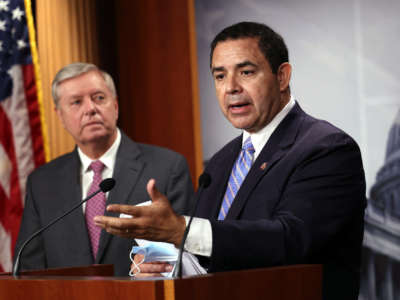 Rep. Henry Cuellar, right, joined by Sen. Lindsey Graham, speaks during a news conference at the U.S. Capitol on July 30, 2021, in Washington, D.C.