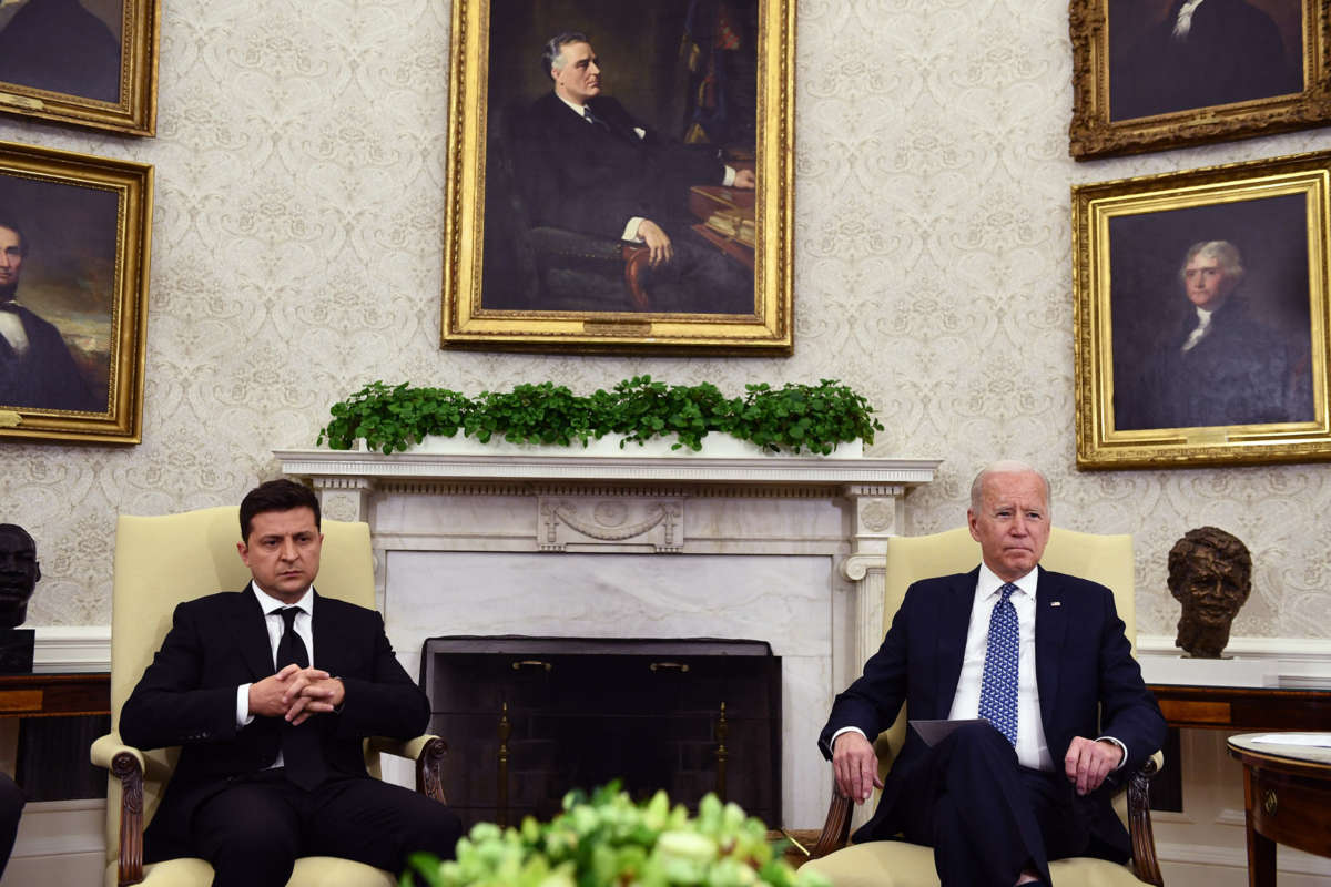 President Joe Biden sits near President Volodymyr Zelensk