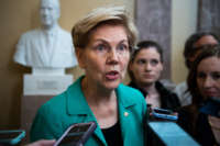 Sen. Elizabeth Warren talks with reporters after the Senate Democratic policy luncheon in the Capitol on Tuesday, July 13, 2021.