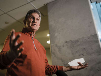 Sen. Joe Manchin speaks during a press availability ahead of a Senate democratic caucus meeting on voting rights and the filibuster on Capitol Hill on January 18, 2022 in Washington, D.C.
