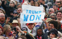 A supporter holds a "Trump Won" sign at a rally by former President Donald Trump at the Canyon Moon Ranch festival grounds on January 15, 2022, in Florence, Arizona.