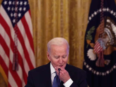 Joe Biden squeezes his lower lip