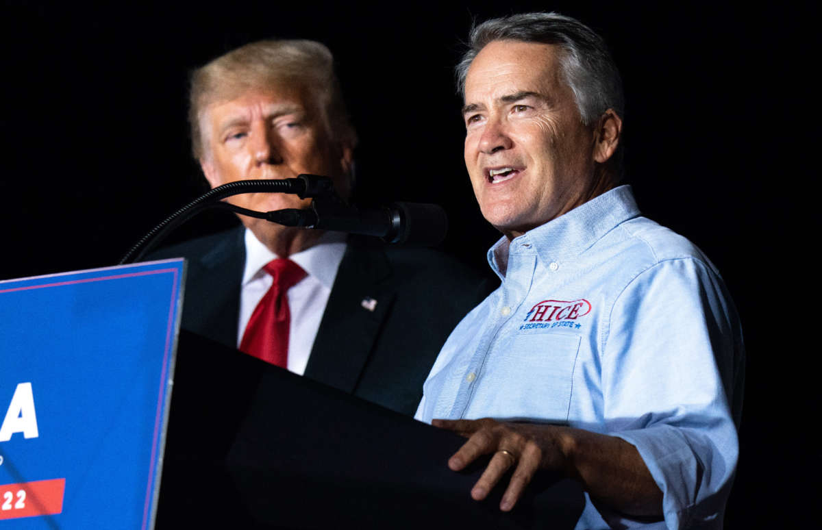 Georgia Secretary of State candidate Rep. Jody Hice speaks to the crowd during a rally as former President Donald Trump watches on September 25, 2021, in Perry, Georgia.