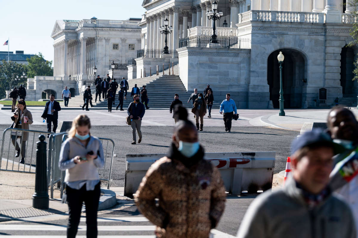 Staffers walk across the East Plaza during an evacuation drill of the Capitol and all the office buildings on November 8, 2021.