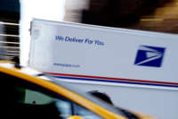 A USPS truck drives on a local street on February 24, 2021, in New York City.
