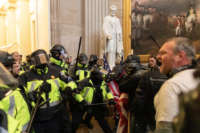 Police intervene against Trump supporters who breached security and entered the Capitol building in Washington, D.C., on January 6, 2021.