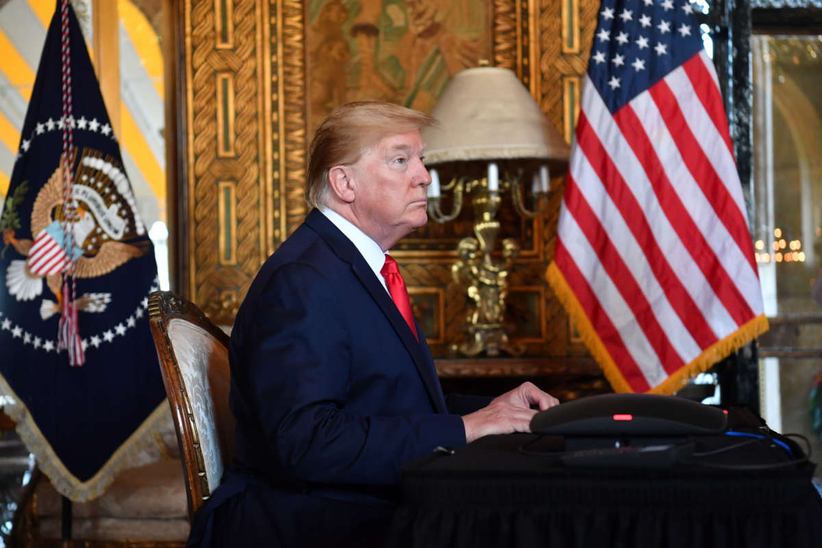 President Donald Trump makes a video call to the troops stationed worldwide at the Mar-a-Lago estate in Palm Beach, Florida, on December 24, 2019.