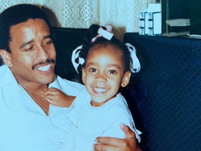 Alexis Pauline Gumbs sits with her father in Edison, New Jersey, in 1986.